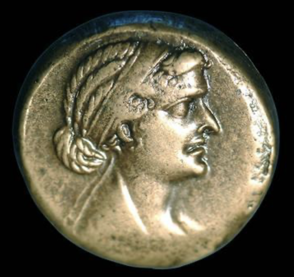 Coin from 49 BC featuring the face of Cleopatra