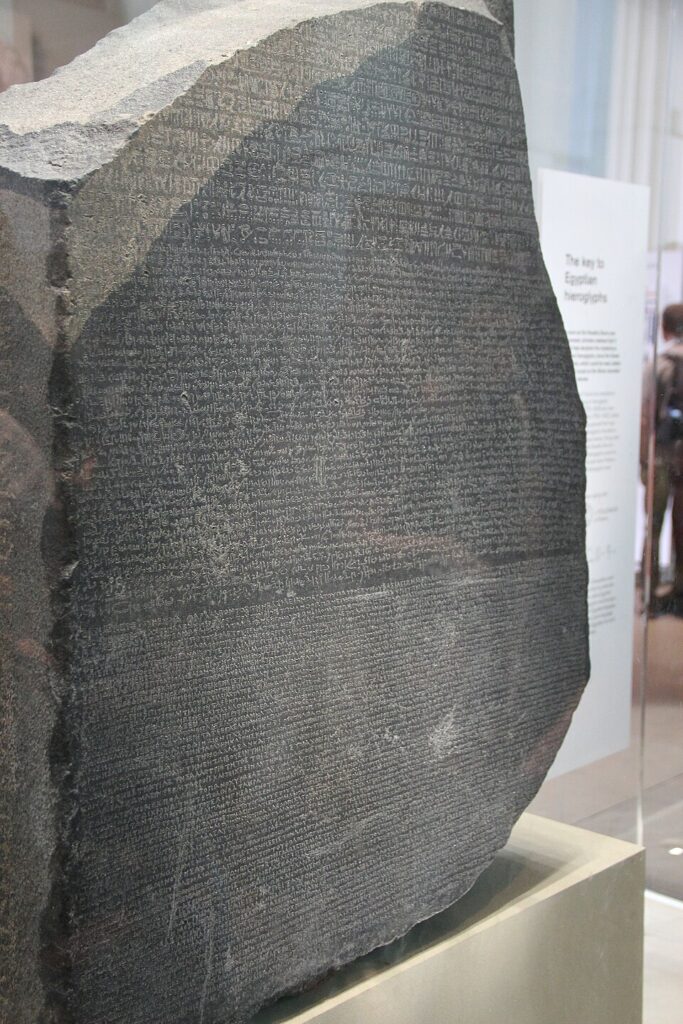 Todd, Gary. "Rosetta Stone, Egypt, Granodiorite Stela of Ptolemy V, 196 BC." 31 July, 2017. https://commons.wikimedia.org/wiki/File:Rosetta_Stone,_Egypt,_Granodiorite_Stela_of_Ptolemy_V,_196_BC_(36399297981).jpg.