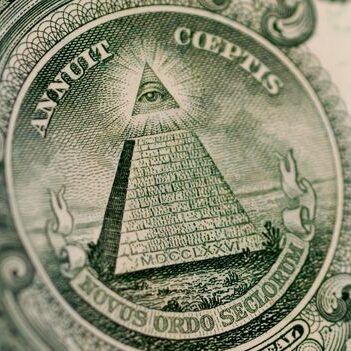 A photo of the pyramid and all seeing eye on the back of the one dollar bill.